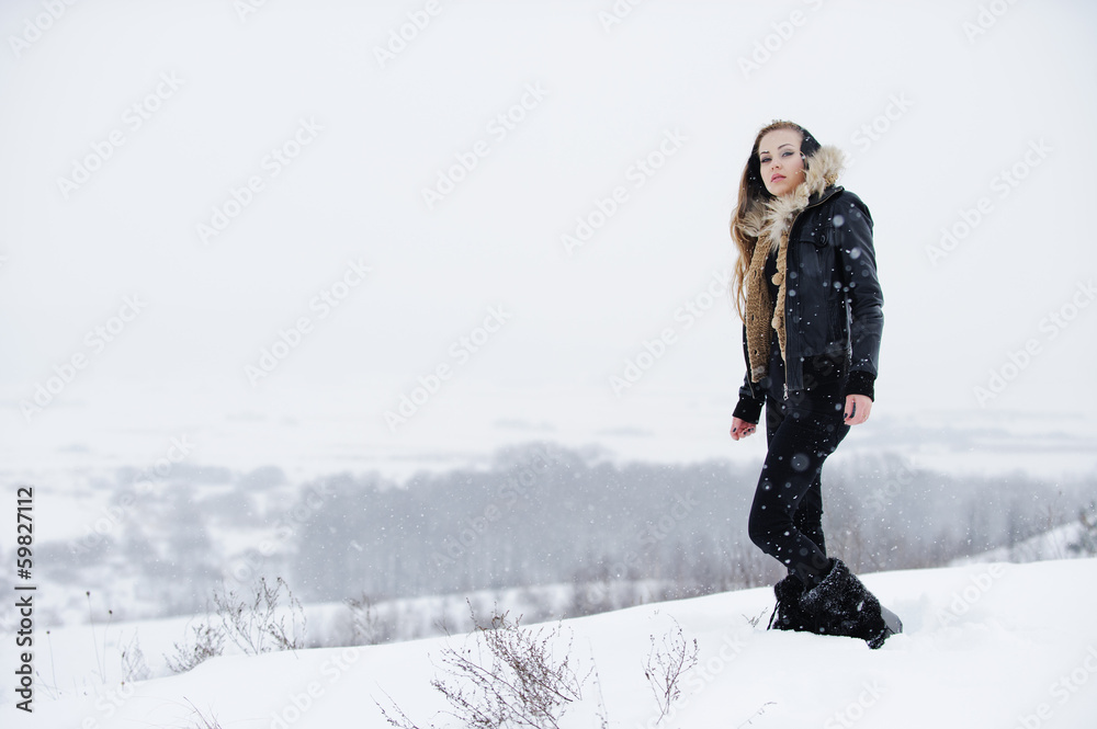 Beautiful girl in white snow