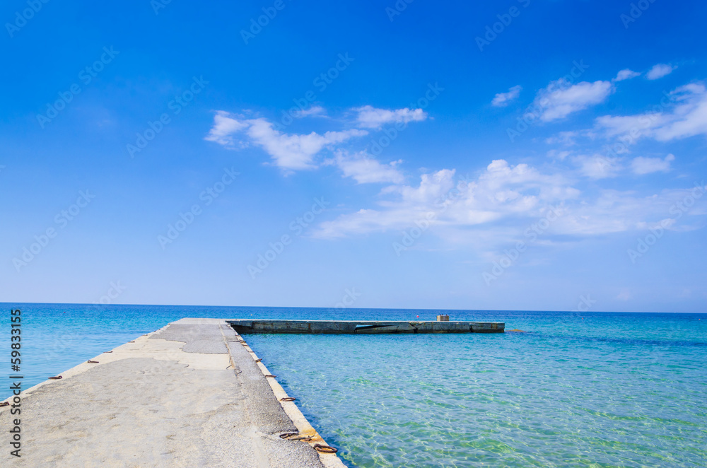 Silent Place, jetty at bright vibrant sky and sea water horizon