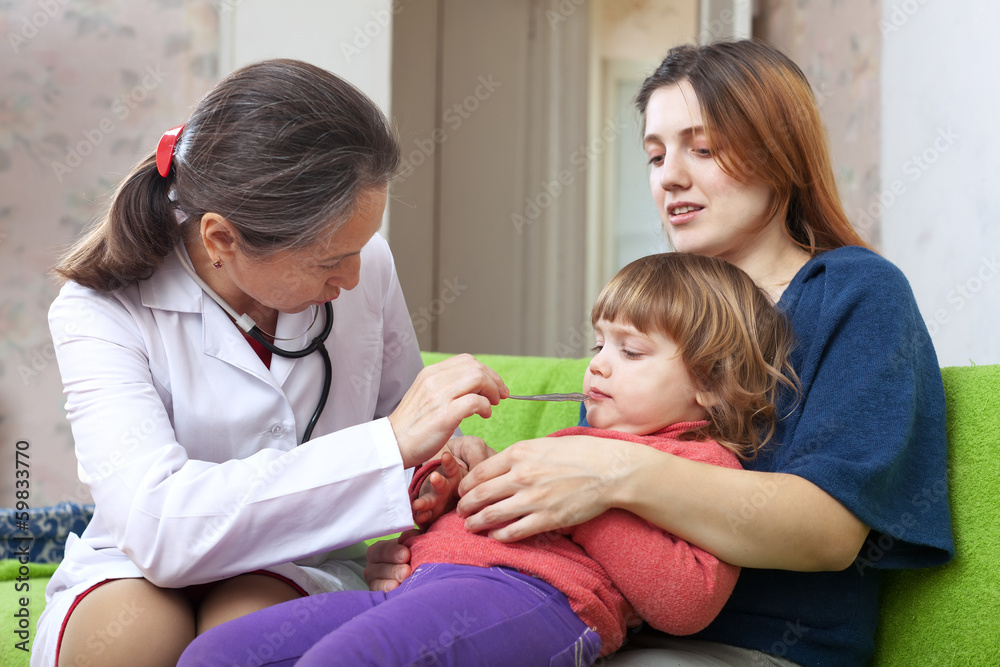 Fototapeta premium pediatrician examining 2 years baby