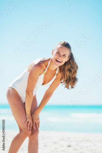 Portrait of smiling young woman on beach