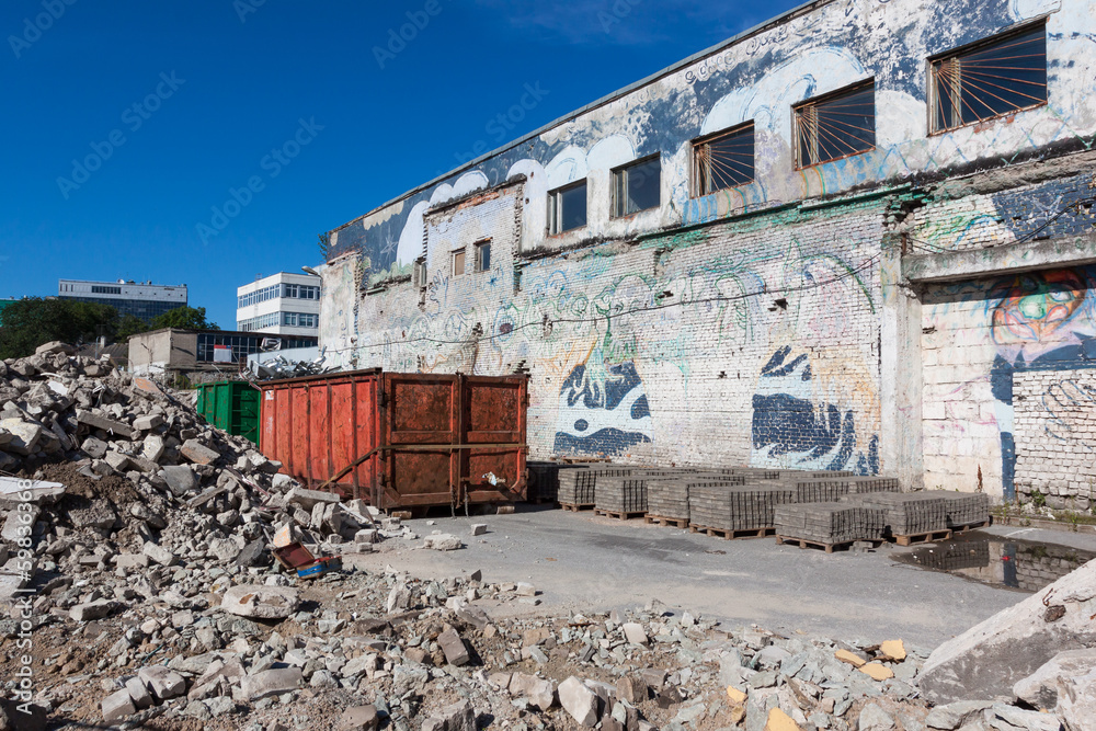 A skip full of rubble on construction site A skip full of rubble on construction site