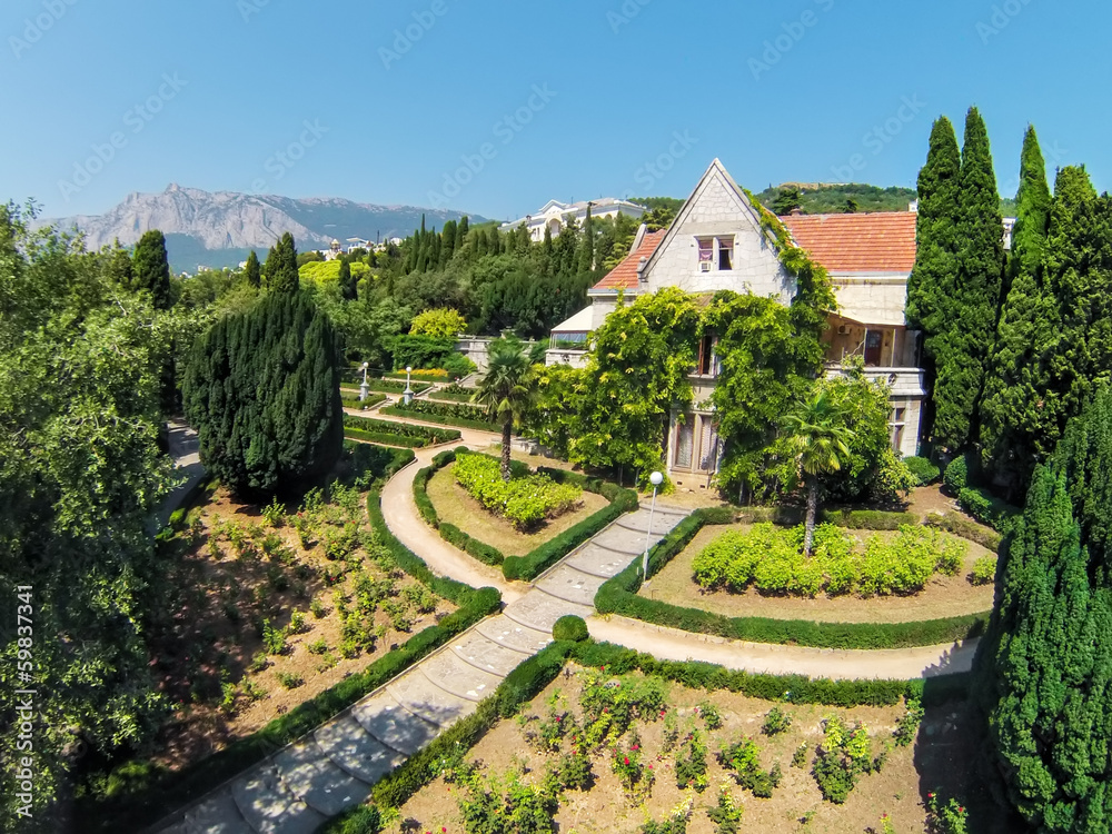 Palace Kharaks with green garden with flowers Palace Kharaks with green garden with flowers