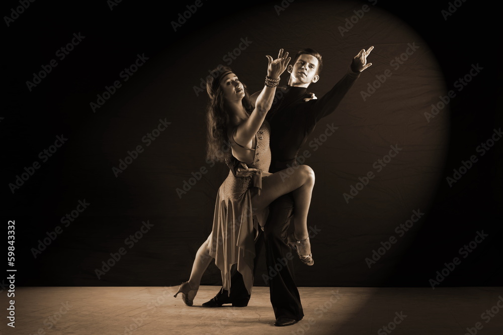 Latino dancers in ballroom isolated on black background Latino dancers in ballroom isolated on black background