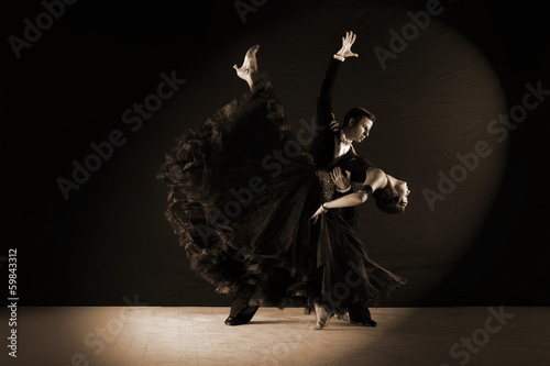 dancers in ballroom isolated on black