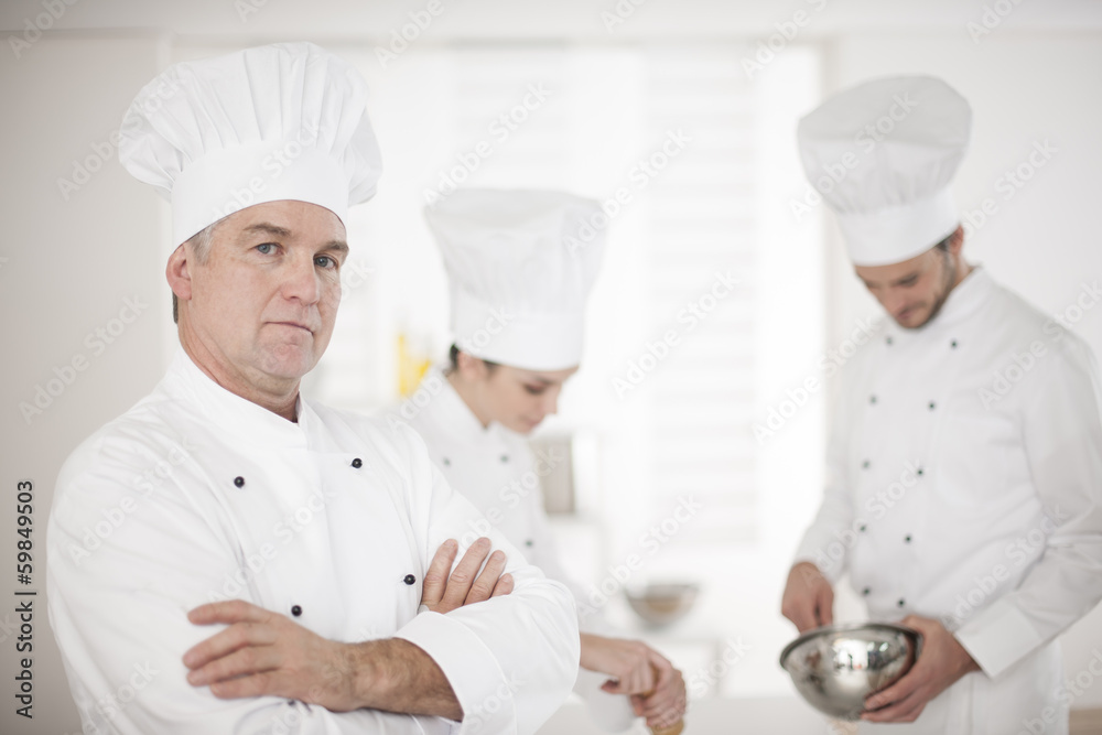 chef and his kitchen team