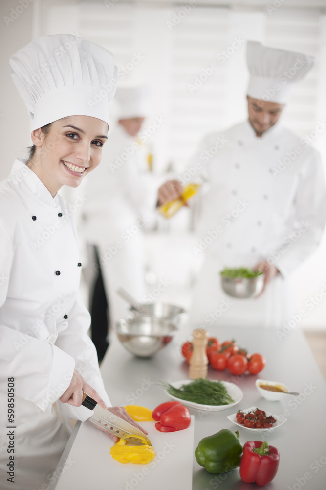 kitchen team at work female chef at foreground kitchen team at work female chef at foreground
