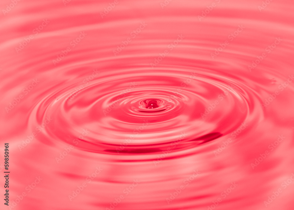 splashing water droplets on red background splashing water droplets on red background