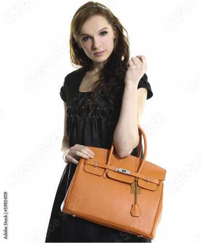 beautiful young woman with modern a handbag