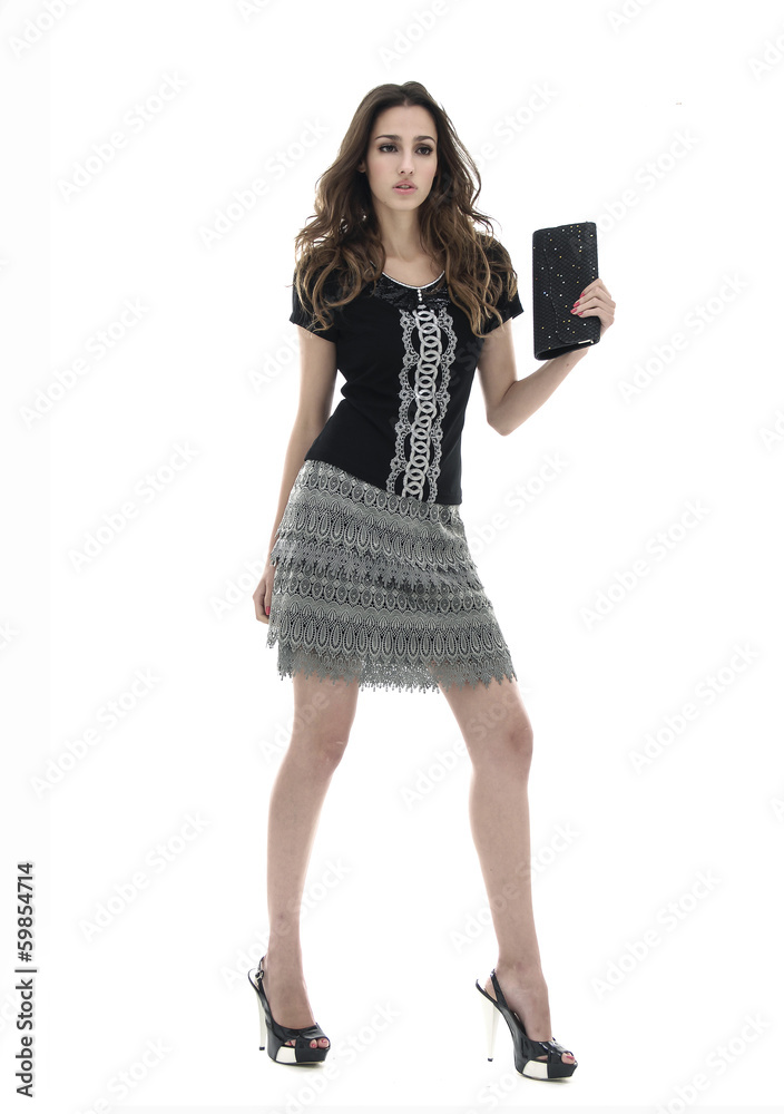 Full body fashion model holding little purse Full body fashion model holding little purse