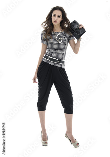 Full body fashion model holding purse posing