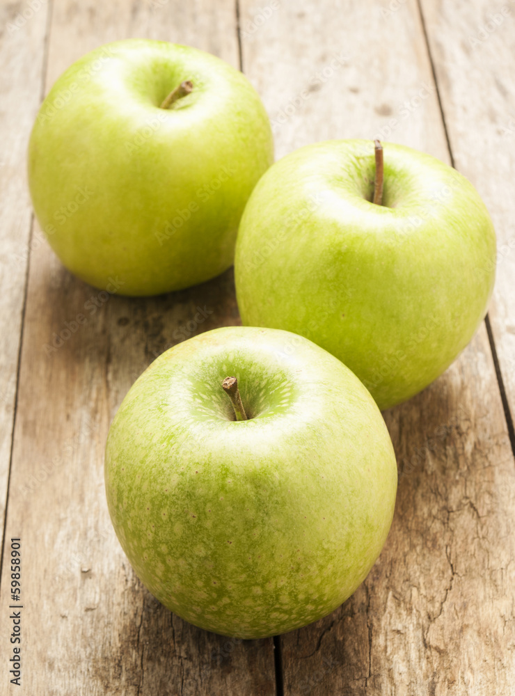 green apple on wooden background green apple on wooden background