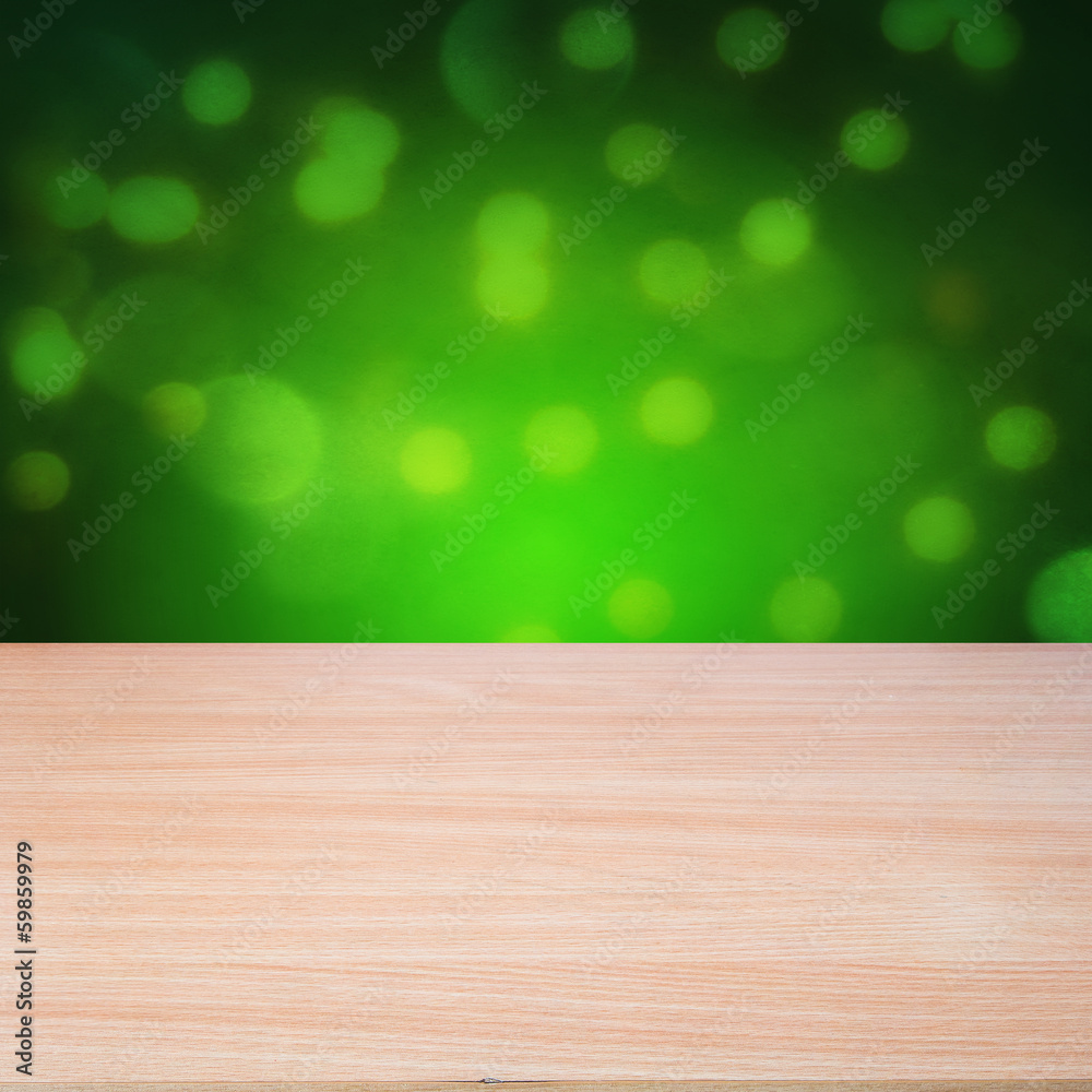 Empty wooden table over over green grunge background Empty wooden table over over green grunge background