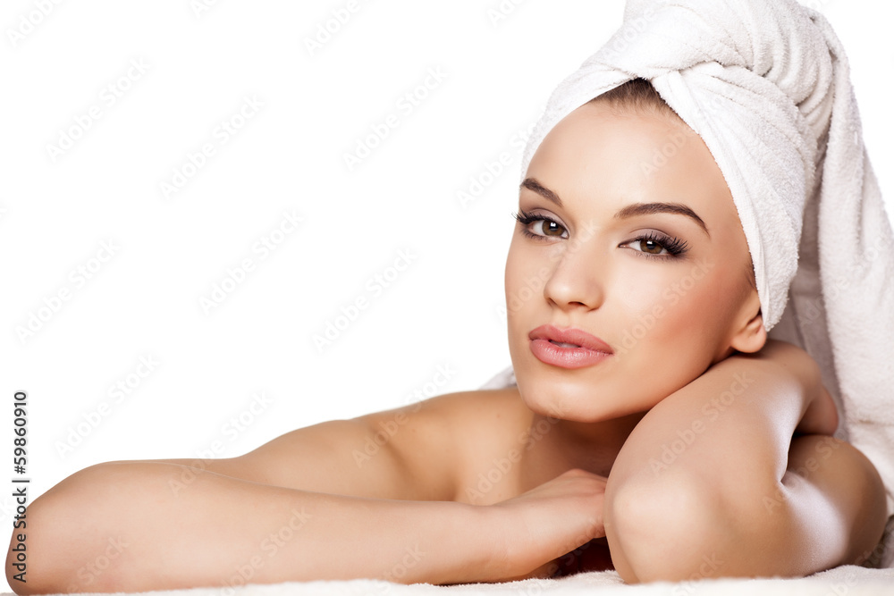 calm beautiful girl with a towel on her head posing on white calm beautiful girl with a towel on her head posing on white