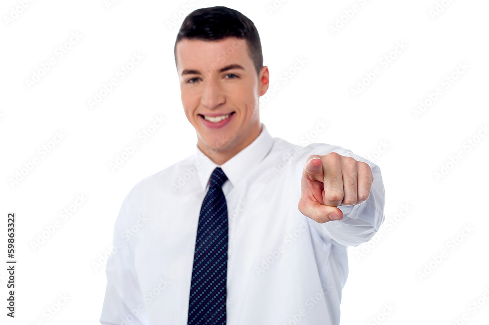 Young smiling businessman pointing you out Young smiling businessman pointing you out