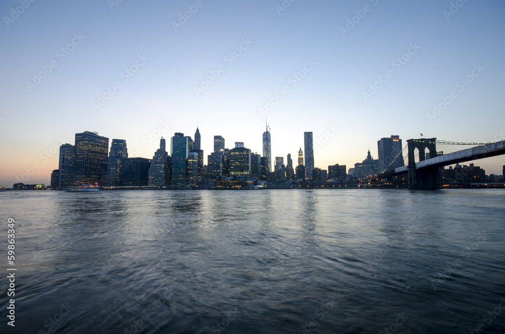 New york Manhattan skyline and Brooklyn bridge. Night scene. USA