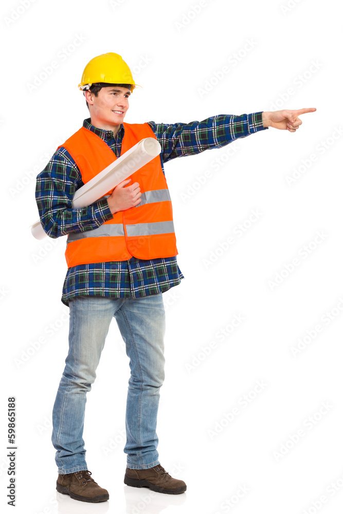 Construction worker holding rolled paper plan and pointing. Construction worker holding rolled paper plan and pointing.