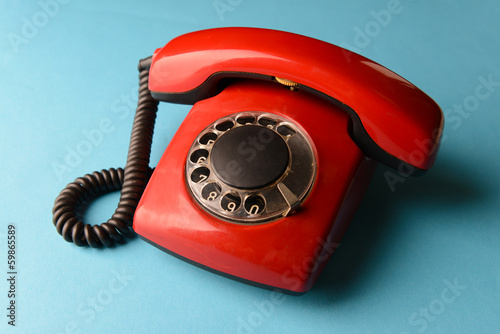 Red retro telephone,on color background