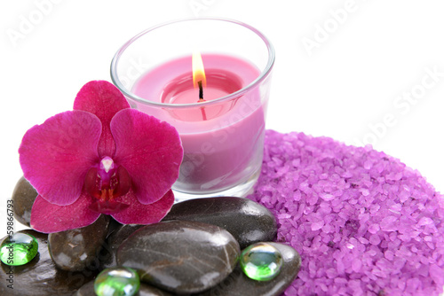 Beautiful colorful candles and orchid flower  isolated on white