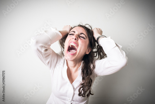 frustrated beautiful young businesswoman photo