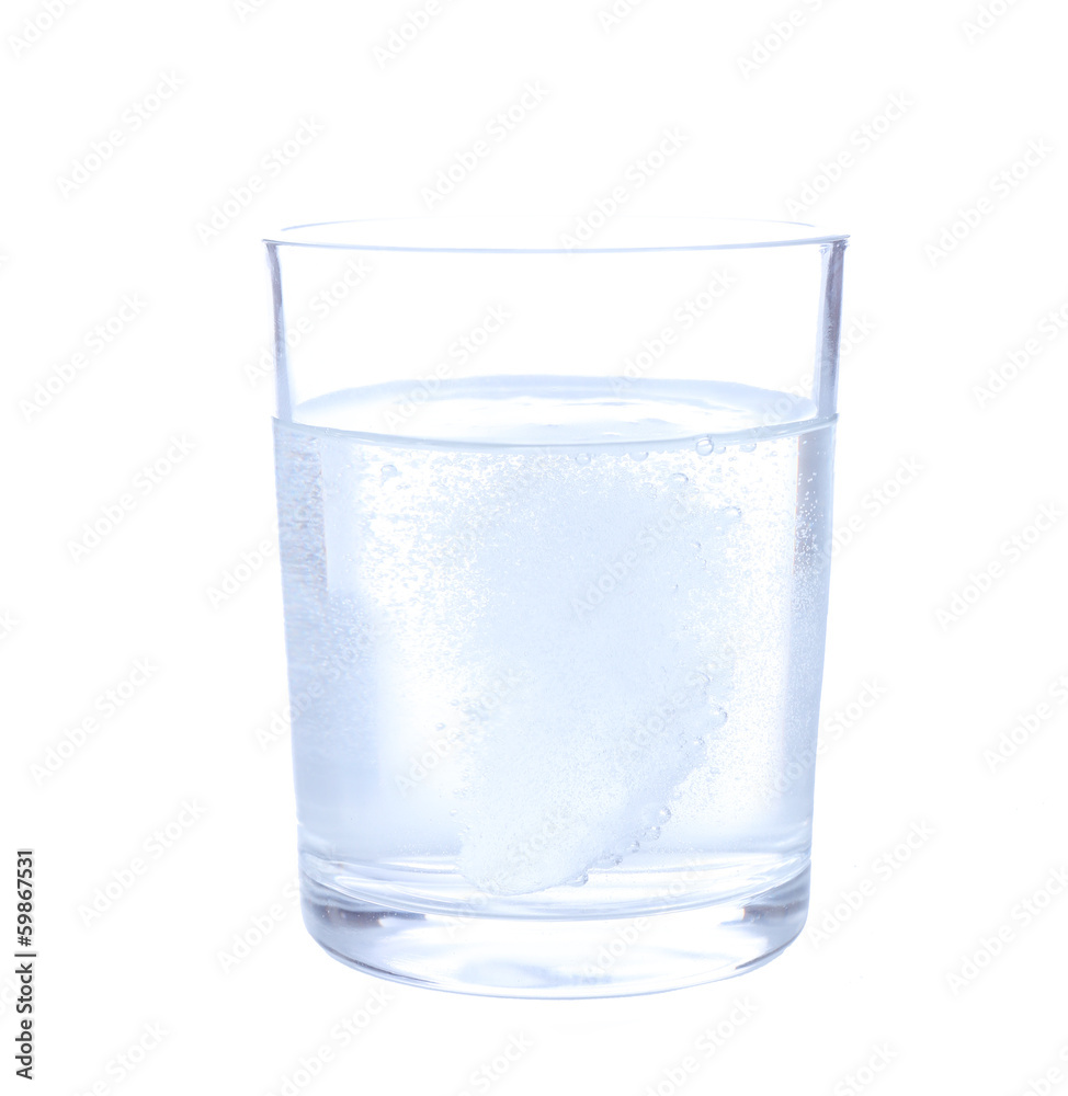 Glass with efervescent tablet in water with bubbles isolated Glass with efervescent tablet in water with bubbles isolated