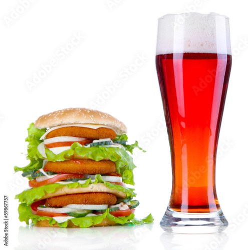 Huge burger and glass cold beer, isolated on white
