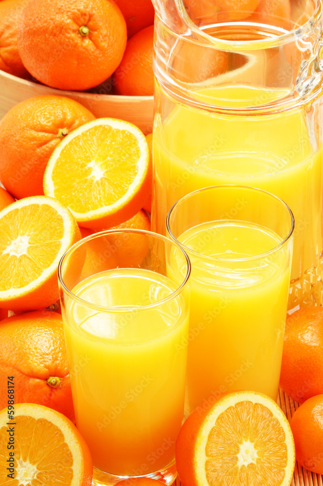 Composition with glasses of orange juice and fruits