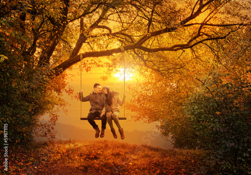 Romantic couple swing in the autumn park