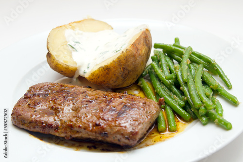 Lamb fillet with beans and potatao photo