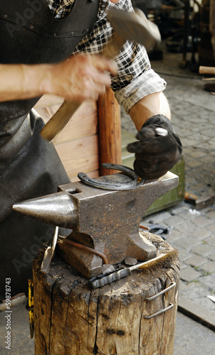 Forging a Horseshoe.