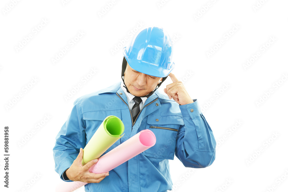 頭痛を訴える作業員 頭痛を訴える作業員
