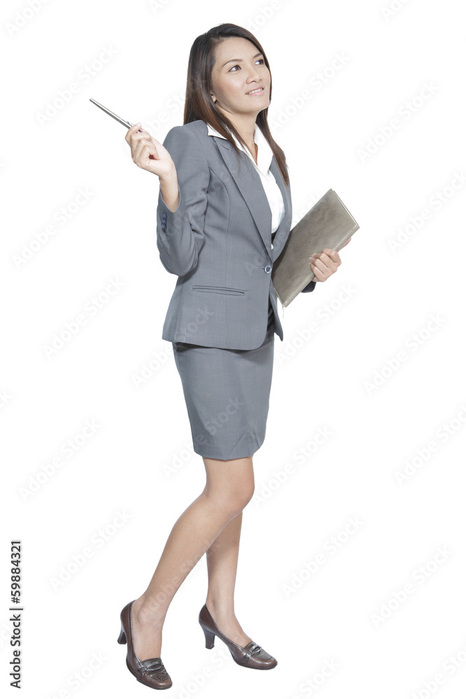 Asian business woman attractive gesture holding a pen and diary Asian business woman attractive gesture holding a pen and diary