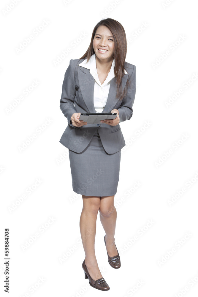 Young pretty Asian business woman gesture using a tablet smiling Young pretty Asian business woman gesture using a tablet smiling