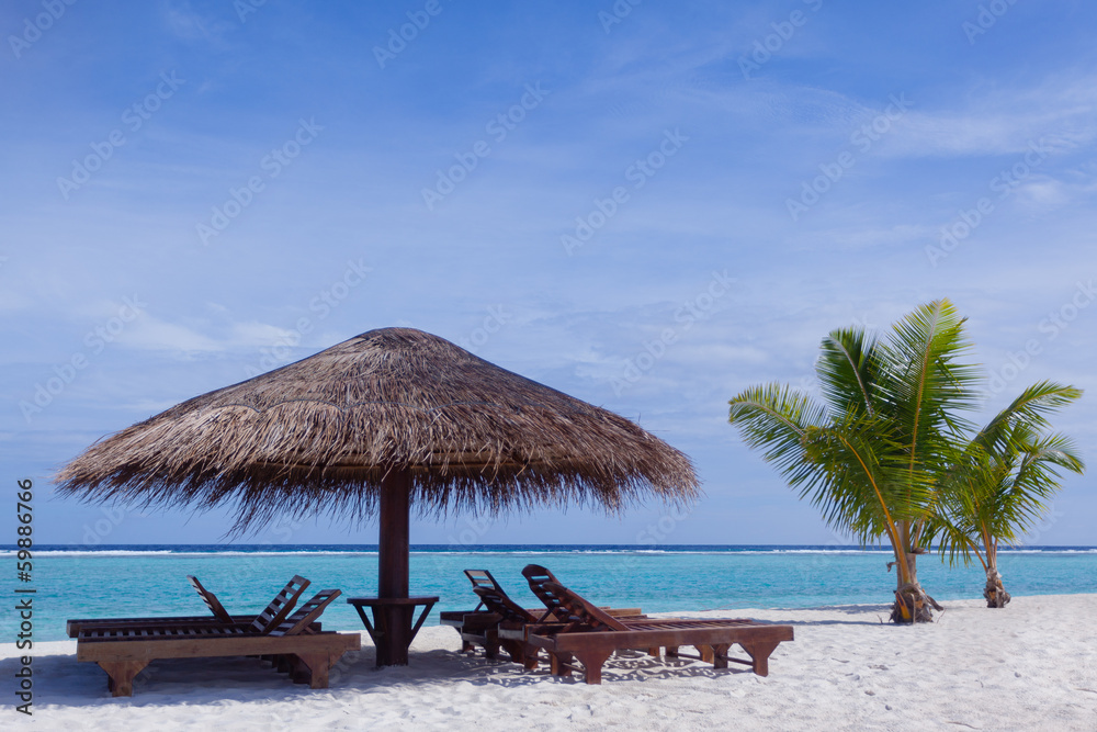 Relaxing chairs in front of the Indian Ocean in Maldive Islands