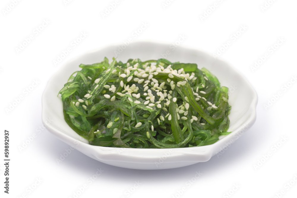 Hiyashi Wakame on shell-shaped dish isolated on white Hiyashi Wakame on shell-shaped dish isolated on white