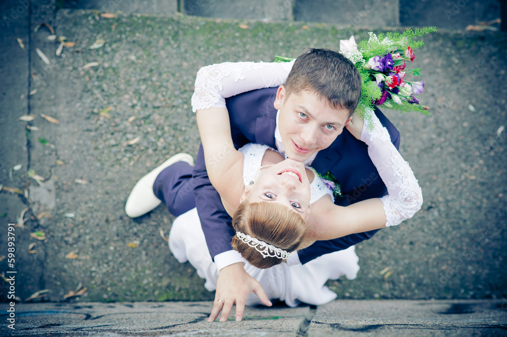 Fototapeta premium bride and groom outdoors after rain