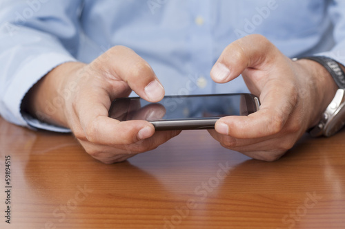 Businessman Using a Cellphone - Isolated
