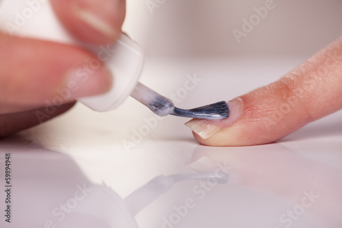 close up of nail polish applying