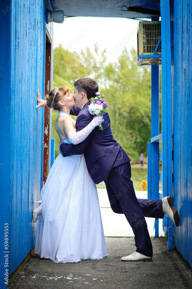 bride and groom in the park, a wedding bouquet, wedding dresses bride and groom in the park, a wedding bouquet, wedding dresses