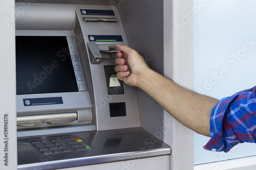 Man placed his credit card at the ATM