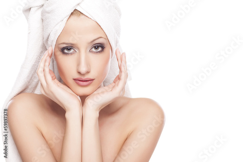 portrait of beautiful serene woman with the towel on her head