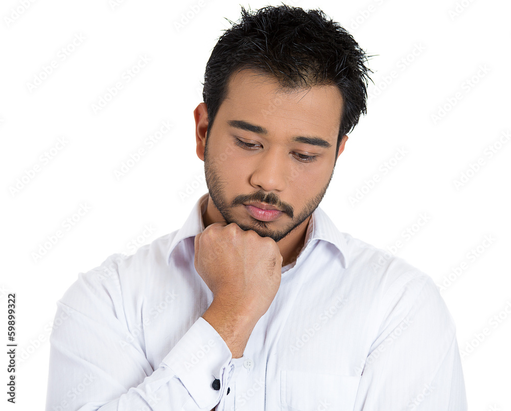 Young, sad man deep in thought, troubled by bad news Young, sad man deep in thought, troubled by bad news