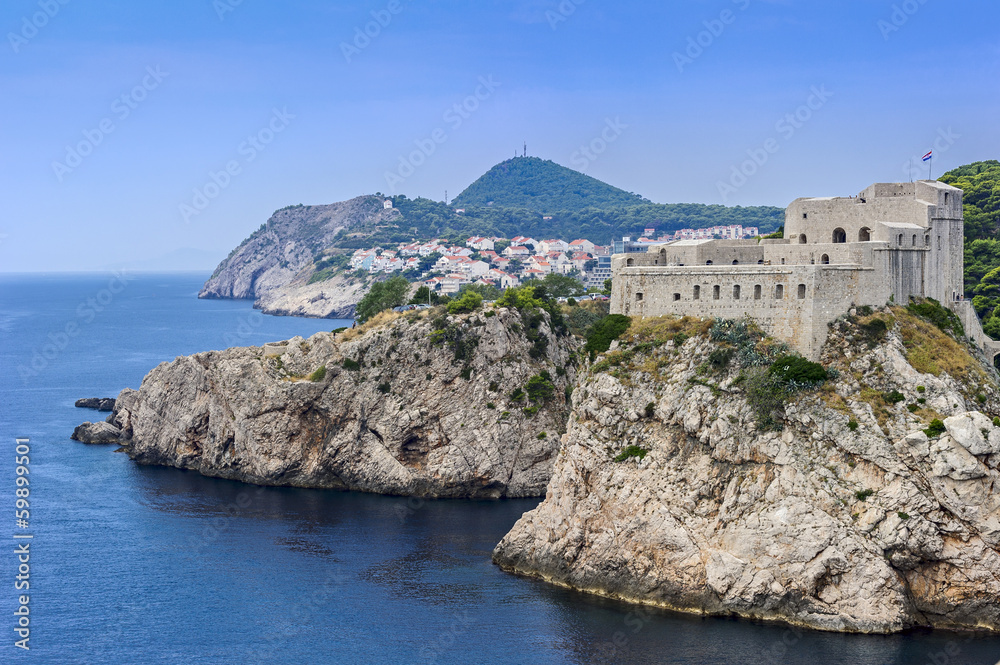 ancient fortress situated on a cliff above the sea
