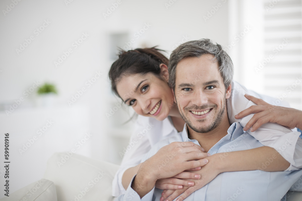 Fototapeta premium Couple at home relaxing in sofa