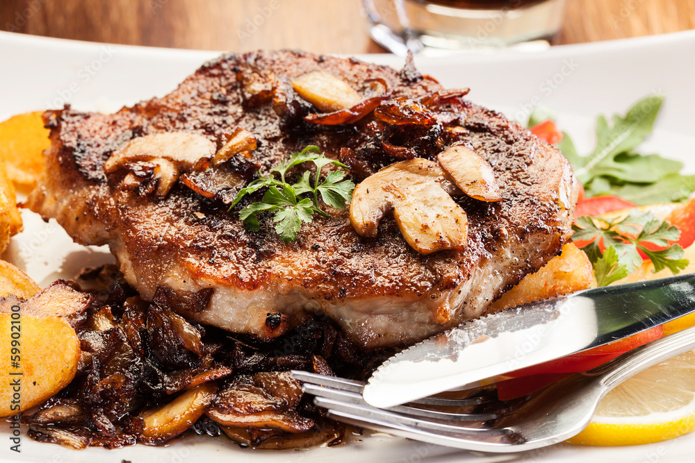 Fried pork chop with mushrooms