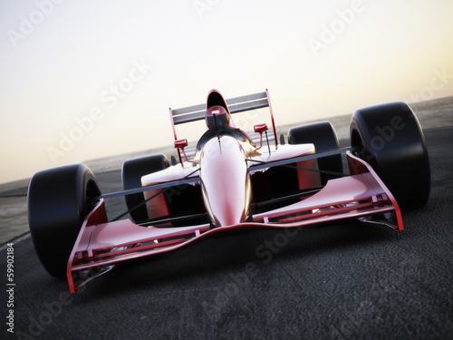 Canvas Print Race car racing on a track front view with motion blur