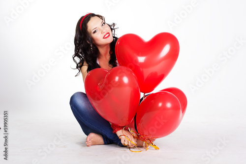 valentine's day beautiful young woman with red balloons