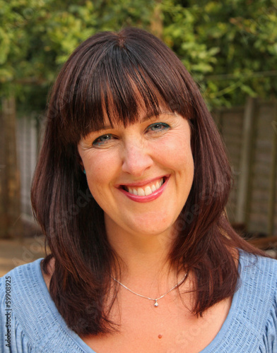 Beautiful outdoor portrait of a stunning middle-aged lady