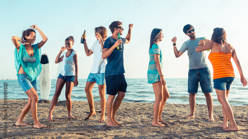 Obraz premium Group of Friends Having a Party on the Beach