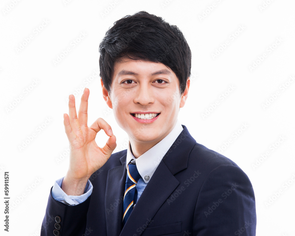 Showing thumb Asian young business man close up shot Showing thumb Asian young business man close up shot
