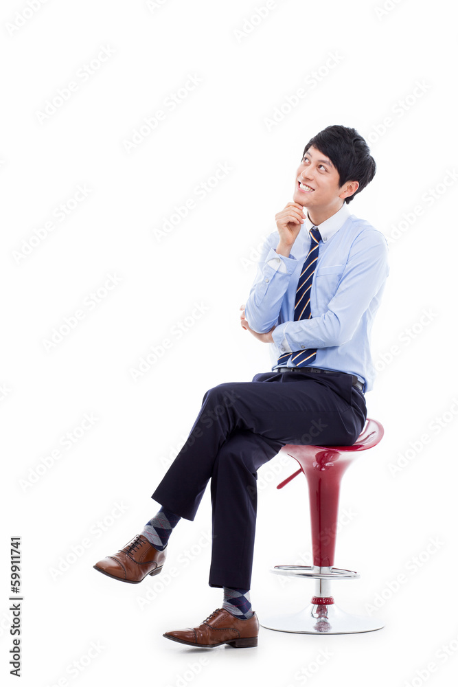 Young Asian business man sitting on the chair Young Asian business man sitting on the chair